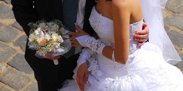 Bride and groom on cobblestone street